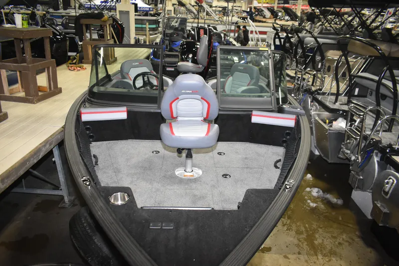 Slide: The Image of 2026 Alumacraft Trophy 175X Sport boat interior with seating and windshield. - 14
