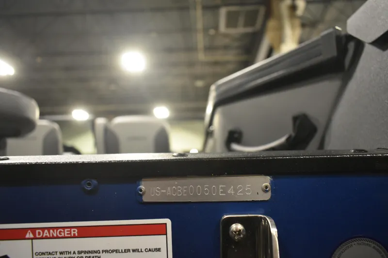 Slide: The Image of 2026 Alumacraft Trophy 175X Sport boat with identification plate and safety warning label. - 19