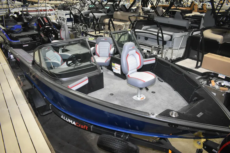Slide: The Image of 2026 Alumacraft Trophy 175X Sport boat with modern seating and sleek design. - 3