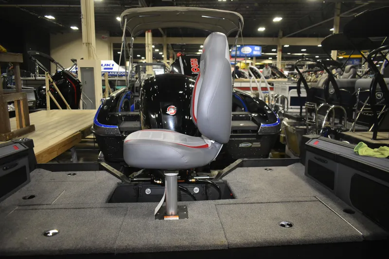 Slide: The Image of 2026 Alumacraft Trophy 175X Sport boat interior with seating and motor display. - 7