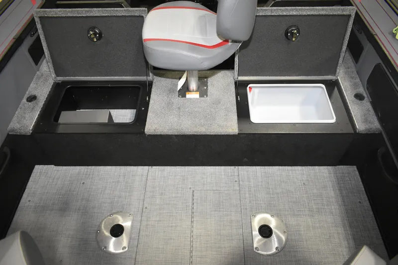 Slide: The Image of 2026 Alumacraft Trophy 175X Sport boat interior with storage compartments and seating. - 9