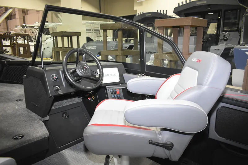 Slide: The Image of Interior of 2026 Alumacraft Trophy 175X Sport boat with steering wheel and captain's chair. - 4