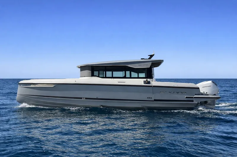 Slide: The Image of Saxdor 320 GTC 2025 cruising on open sea, modern design. - 3