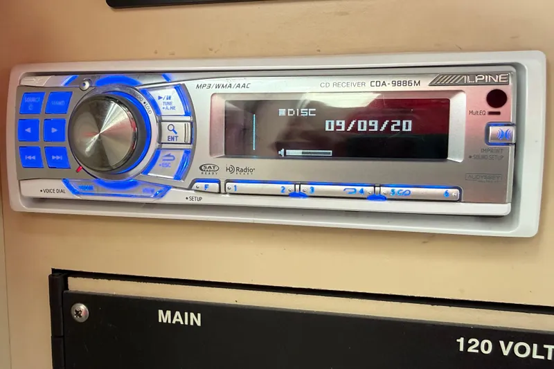 Slide: The Image of Alpine CD receiver in 1998 Sea Ray Sundancer 310 boat, displaying date 09/09/20. - 26