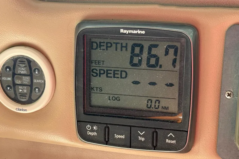 Slide: The Image of Depth gauge and control panel on 1998 Sea Ray Sundancer 310 boat dashboard. - 38