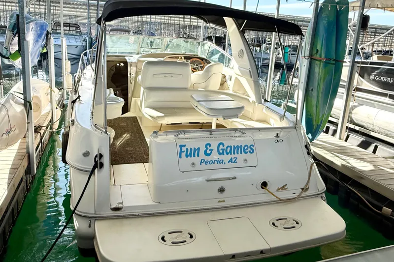 Slide: The Image of 1998 Sea Ray Sundancer 310 docked, named "Fun & Games," Peoria, AZ. - 5
