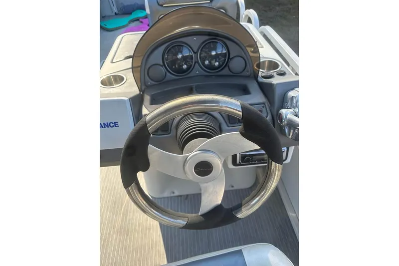 Slide: The Image of Steering wheel and dashboard of 2008 Crestliner Grand Cayman 2585 boat. - 4