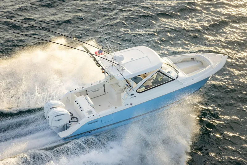 The Image of 2026 Pursuit DC 286 Dual Console boat cruising on open water, showcasing sleek design and performance. - 0