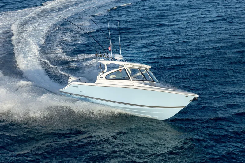 Slide: The Image of 2026 Pursuit DC 286 Dual Console boat cruising on open ocean waters. - 2