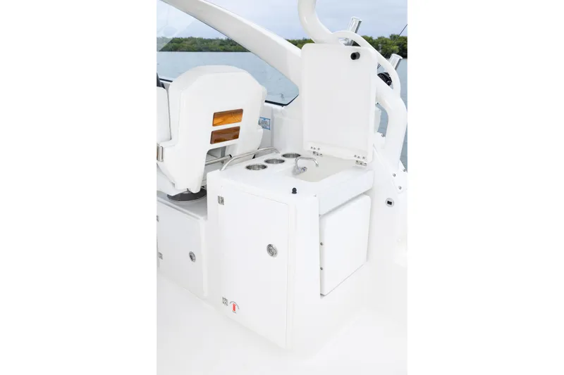 Slide: The Image of 2026 Pursuit DC 286 Dual Console boat interior with seating and storage compartments. - 21