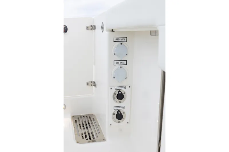 Slide: The Image of 2026 Pursuit DC 286 Dual Console water and engine flush controls. - 23