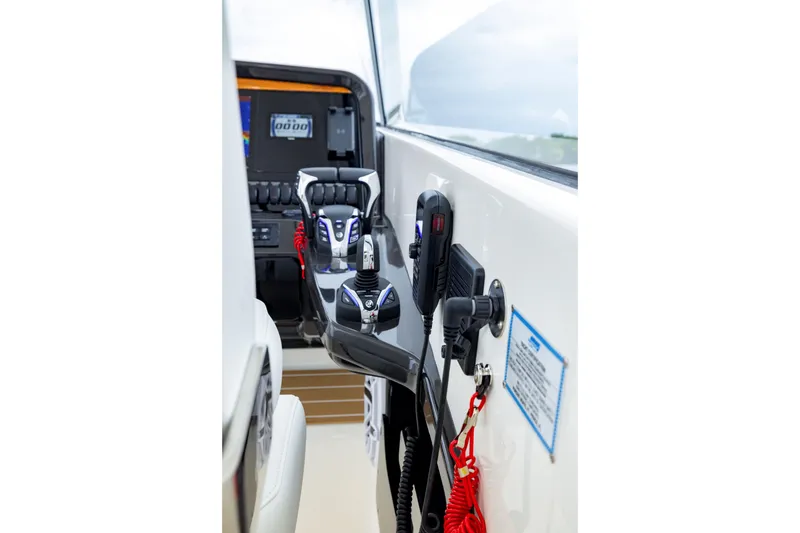 Slide: The Image of 2026 Pursuit DC 286 Dual Console boat cockpit with advanced controls and navigation system. - 27