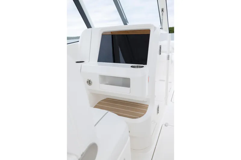 Slide: The Image of 2026 Pursuit DC 286 Dual Console interior with sleek white design and wood accents. - 29