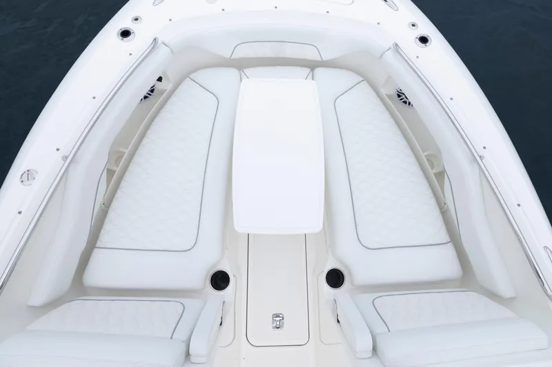 Slide: The Image of 2026 Pursuit DC 286 Dual Console boat with luxurious white seating and sleek design. - 32