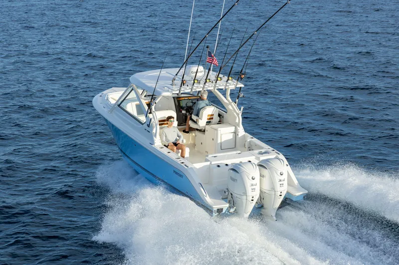 Slide: The Image of 2026 Pursuit DC 286 Dual Console boat cruising on open water. - 5