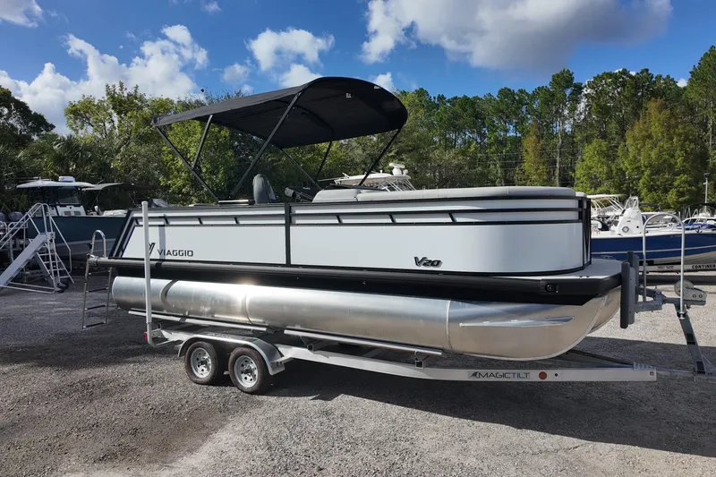 The Image of 2026 Viaggio Lago V 20 C pontoon boat on trailer, parked outdoors. - 0