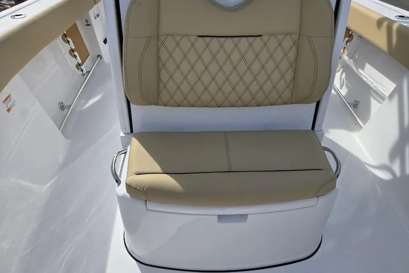 Slide: The Image of 2026 Sportsman Open 262 Center Console boat seat with beige upholstery and diamond stitching. - 10
