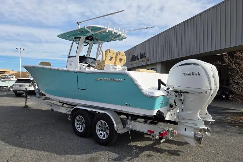 Slide: The Image of 2026 Sportsman Open 262 Center Console boat on trailer, featuring Yamaha outboard engine. - 2