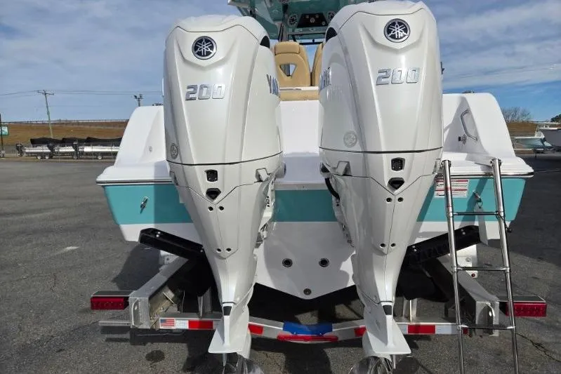 Slide: The Image of 2026 Sportsman Open 262 Center Console with twin Yamaha 200 engines, rear view. - 4