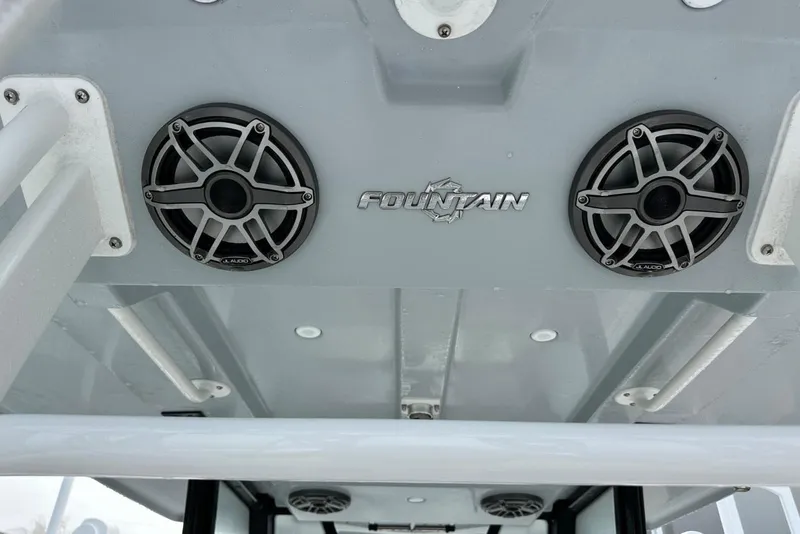 Slide: The Image of 2024 Fountain 38 Center Console boat speakers and logo on ceiling. - 17