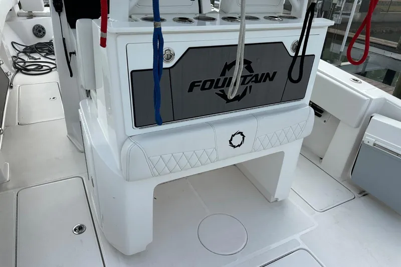Slide: The Image of 2024 Fountain 38 Center Console boat interior with storage and seating. - 19