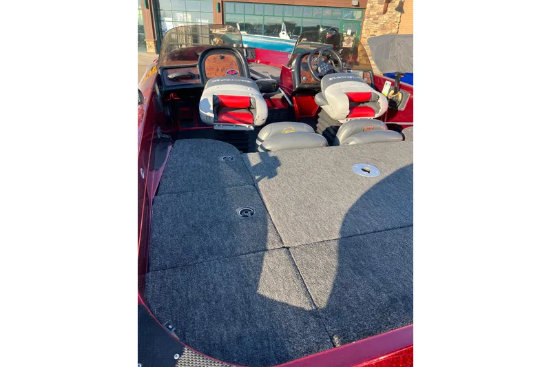 Slide: The Image of 2000 Ranger 619DVS Fisherman boat interior with seating and carpeted deck. - 4