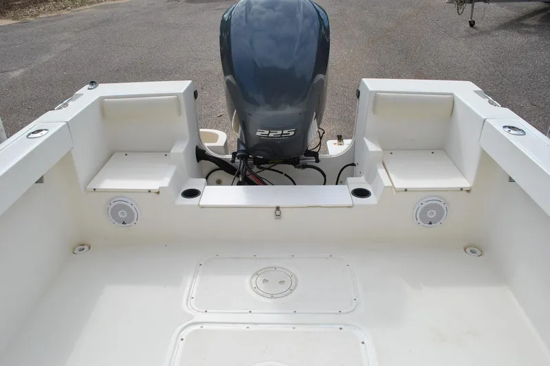 Slide: The Image of 1996 Pursuit 2150 Walkaround boat with 225 engine, spacious deck, and seating area. - 14