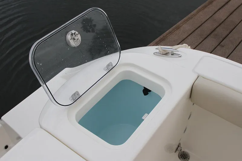 Slide: The Image of Manufacturer Provided Image: 2019 Cobia 220 Center Console boat with open storage compartment. - 6