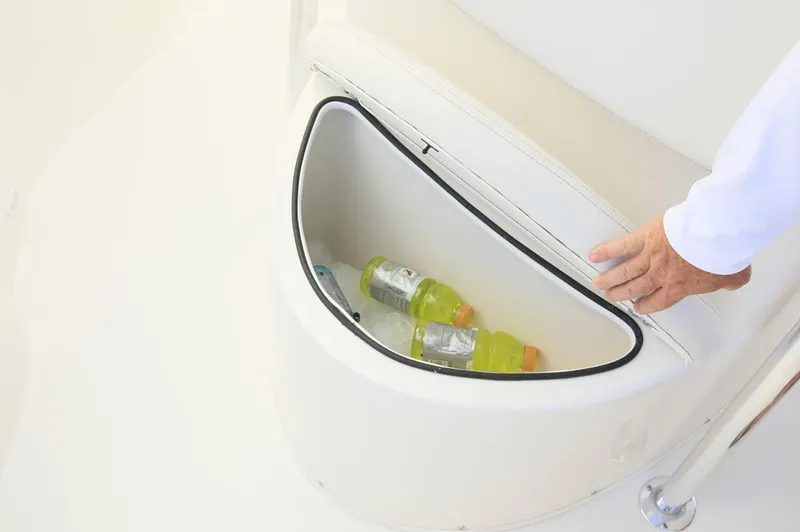 Slide: The Image of Manufacturer Provided Image: Storage compartment with drinks on 2019 Cobia 220 Center Console boat. - 8