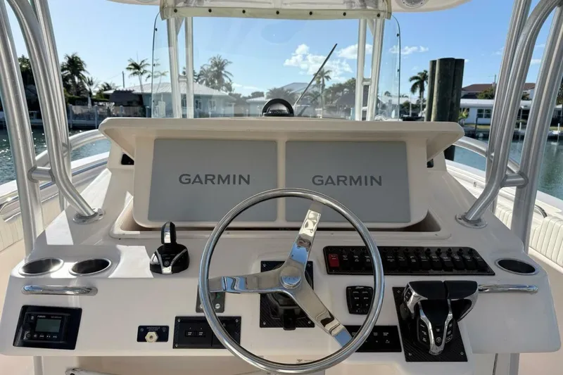 Slide: The Image of 2011 Grady-White Canyon 336 boat helm with Garmin navigation displays. - 12