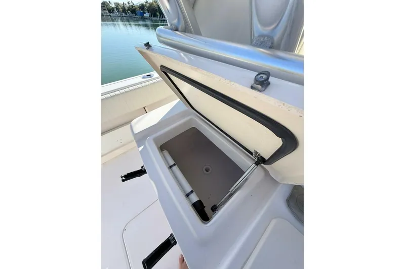 Slide: The Image of Open storage compartment on 2011 Grady-White Canyon 336 boat, near calm waters. - 24