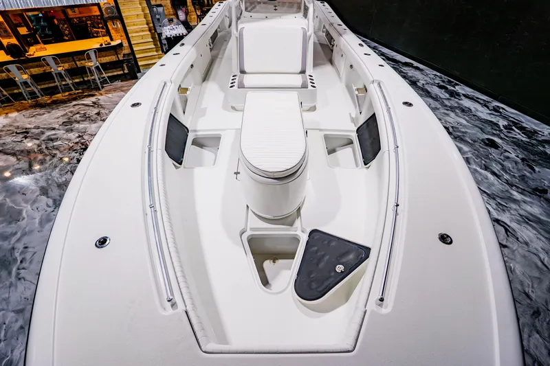 Slide: The Image of 2012 Yellowfin 39 Offshore boat interior with seating and storage compartments. - 11