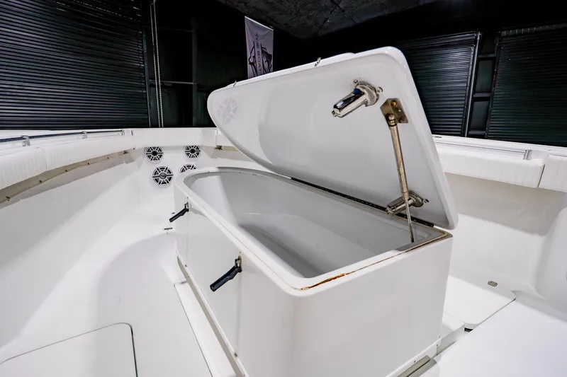 Slide: The Image of Open storage compartment on 2012 Yellowfin 39 Offshore boat interior. - 12