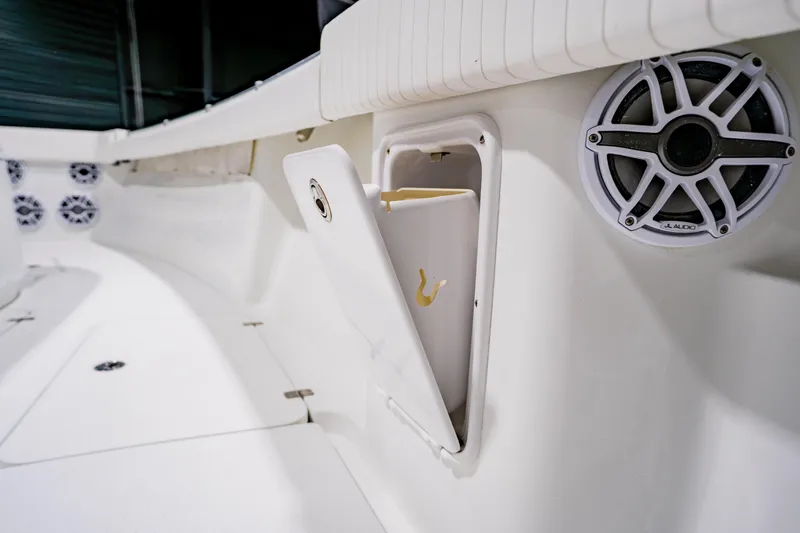 Slide: The Image of 2012 Yellowfin 39 Offshore boat interior with speaker and storage compartment. - 13