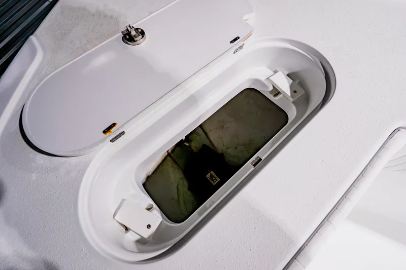 Slide: The Image of Open storage compartment on 2012 Yellowfin 39 Offshore boat deck. - 14