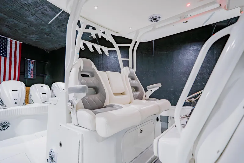 Slide: The Image of 2012 Yellowfin 39 Offshore boat interior with plush seating and modern design. - 20