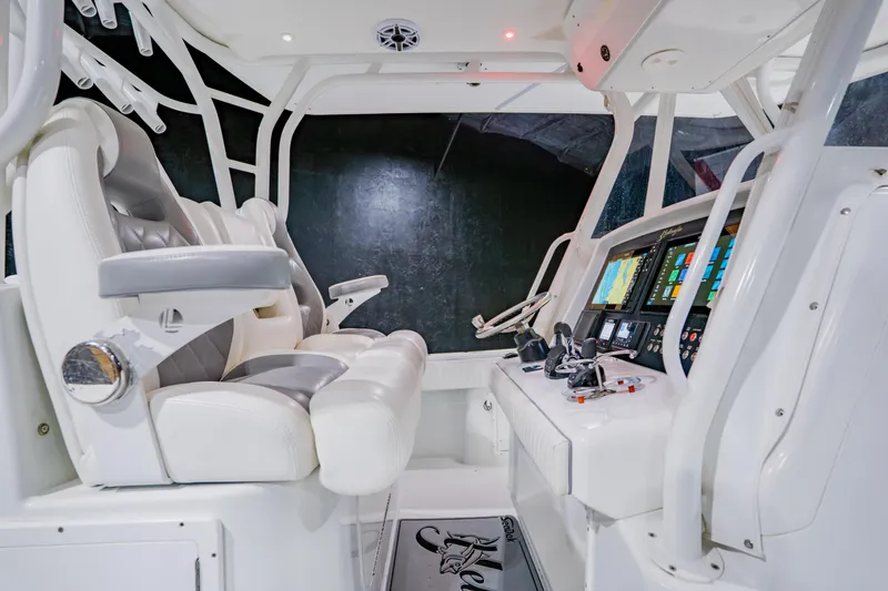 Slide: The Image of 2012 Yellowfin 39 Offshore boat cockpit with advanced navigation systems and comfortable seating. - 22