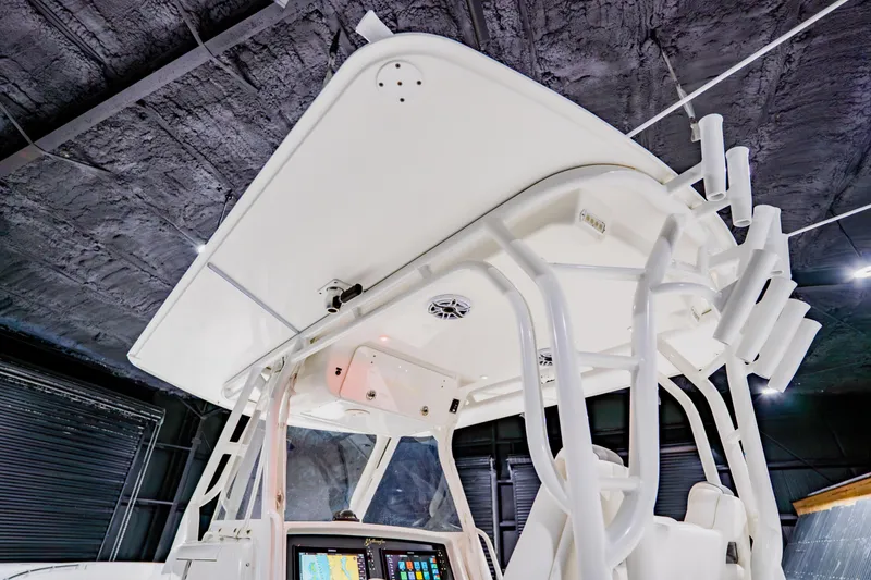 Slide: The Image of 2012 Yellowfin 39 Offshore boat interior with advanced navigation system and rod holders. - 24