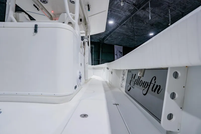 Slide: The Image of 2012 Yellowfin 39 Offshore boat interior, showcasing sleek white design and spacious layout. - 28