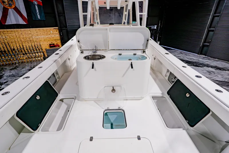 Slide: The Image of 2012 Yellowfin 39 Offshore boat interior with fishing rod storage and sink. - 31