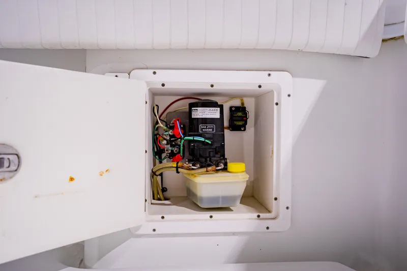 Slide: The Image of Electrical compartment of 2012 Yellowfin 39 Offshore boat, featuring wiring and components. - 39