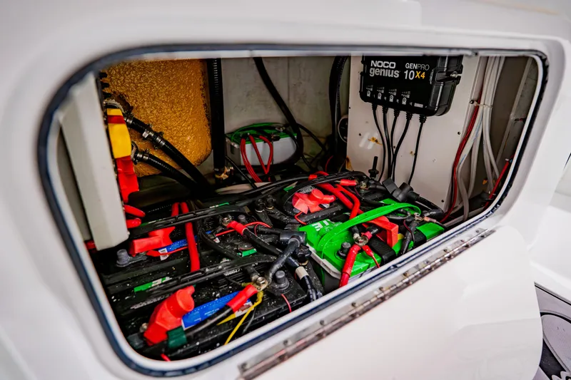Slide: The Image of Battery compartment of 2012 Yellowfin 39 Offshore boat with NOCO Genius charger. - 46