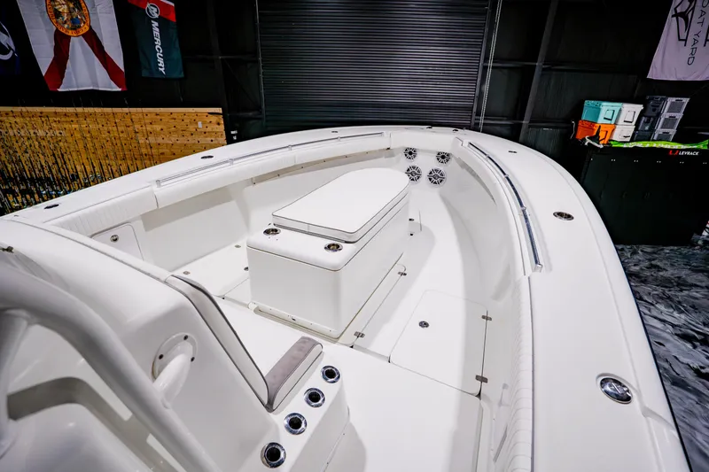 Slide: The Image of 2012 Yellowfin 39 Offshore boat interior with seating and storage compartments. - 7