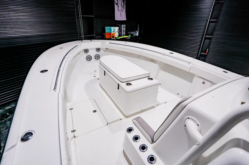 Slide: The Image of 2012 Yellowfin 39 Offshore boat interior with seating and storage compartments. - 8