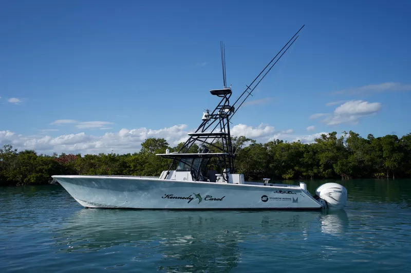 Slide: The Image of 2019 SeaHunter 45 Tournament boat on calm water with clear blue sky. - 1
