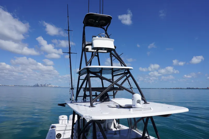Slide: The Image of 2019 SeaHunter 45 Tournament boat on calm water under a clear blue sky. - 12
