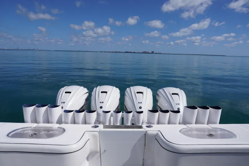 Slide: The Image of 2019 SeaHunter 45 Tournament boat with four V8 engines on calm ocean. - 16