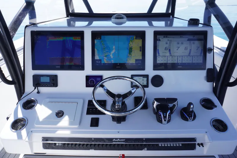 Slide: The Image of 2019 SeaHunter 45 Tournament boat dashboard with advanced navigation and control systems. - 24