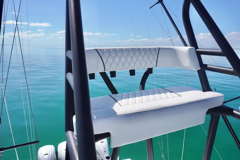 Slide: The Image of 2019 SeaHunter 45 Tournament boat with elevated seating, overlooking calm ocean waters. - 35