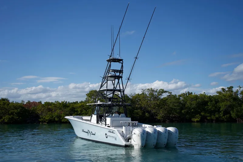 Slide: The Image of 2019 SeaHunter 45 Tournament boat with multiple engines on calm water. - 7